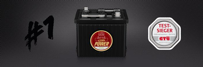 Das Bild zeigt eine Batterie mit der Aufschrift Oldtimer-Power. Rechts daneben wird eine Plakette dargestellt, die die Batterie als Testsieger auszeichnet.