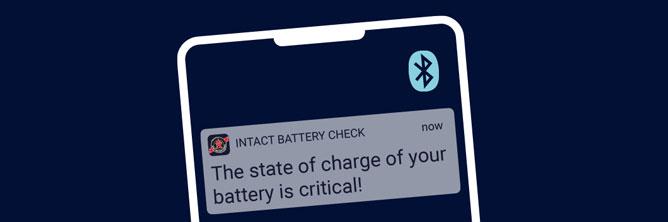 The graphic shows a smartphone with a push message in the Battery Guards. The message indicates a critical battery charge status.
